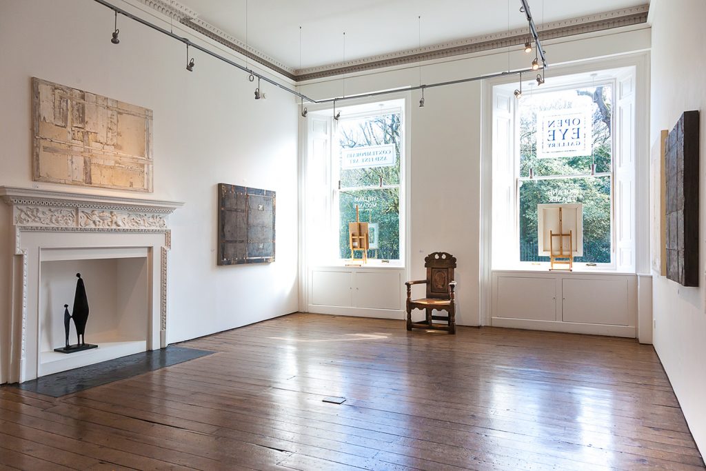 Interior of Open Eye Gallery, showing fireplace on left.