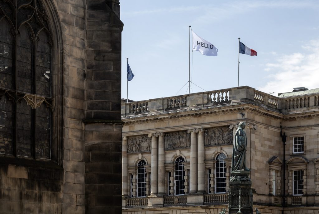 Skyline featuring flags of of French Consulate on Edinburgh's Royal Mile.