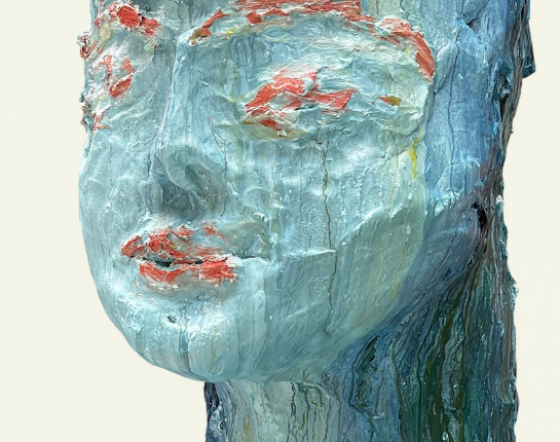 Sculptural image of head in blue and orange.