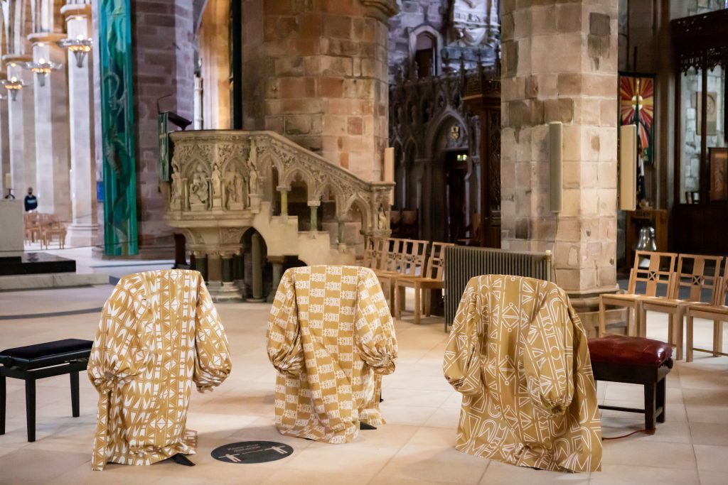 Garments hang over chairs at St Giles Cathederal