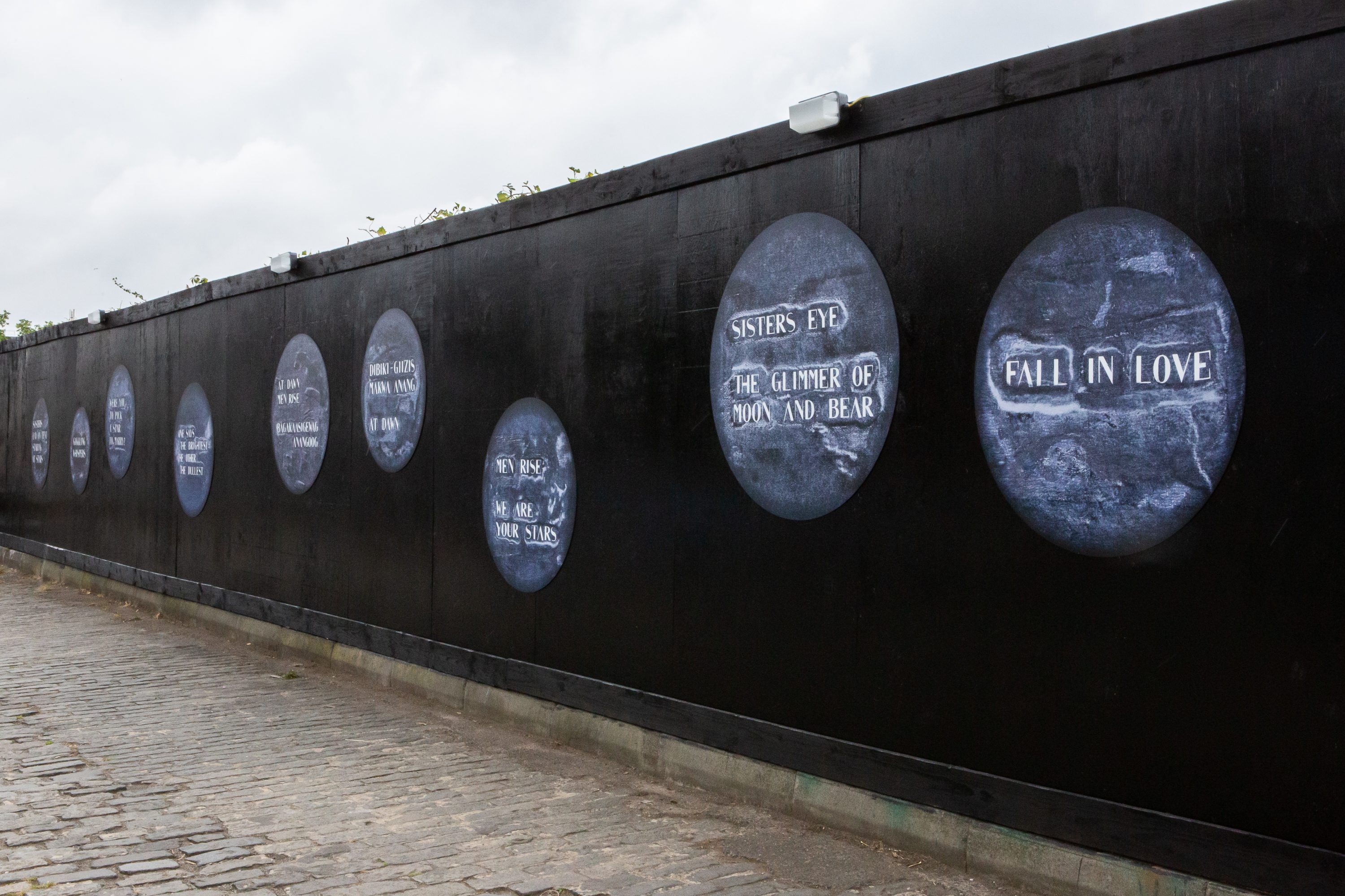 Sidings with circular print work in blue on the Union Canal, created by Nadia Myre.